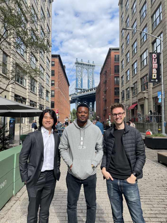 An image of Stuart, Backend Developer at Kisi, with two other Kisi developers with the Brooklyn Bridge