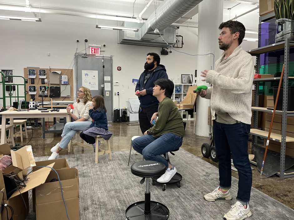 An image of Kisi's Backend Developer Intern having fun with other Kisi employees in the New York office