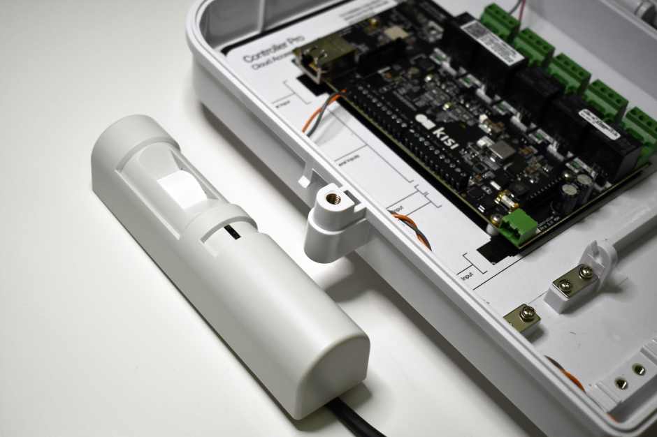 an image showing a motion sensor wired to Kisi access controller