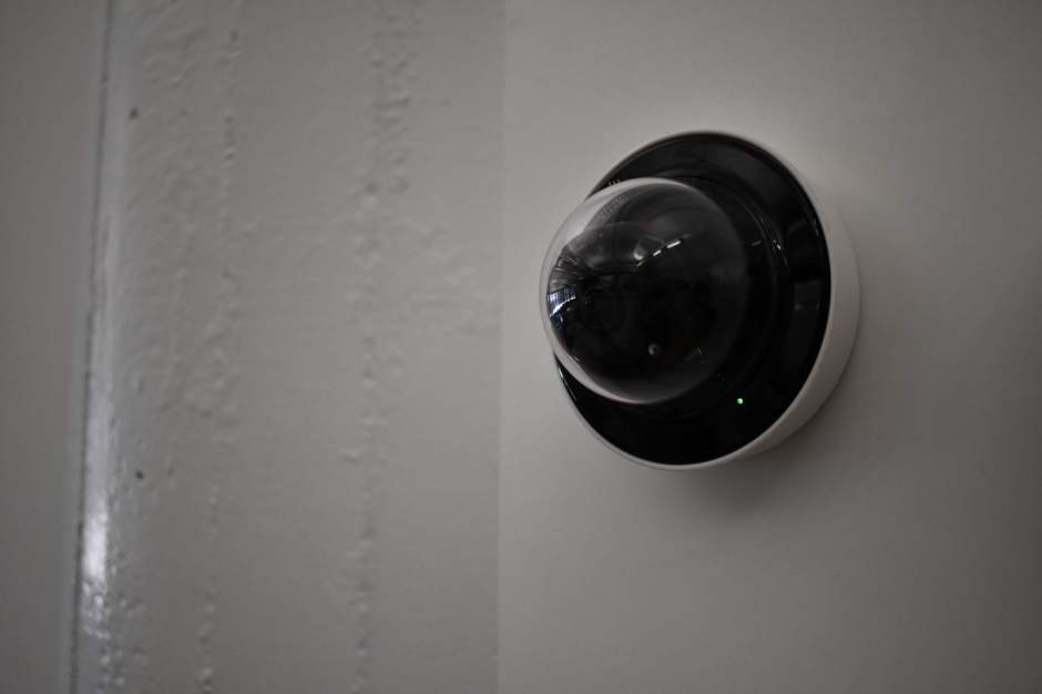 an image of a dome security camera mounted on a wall