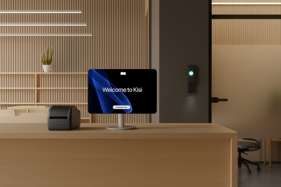 Visitor badge printing hardware at a front desk, including visitor kiosk tablet and a badge printer