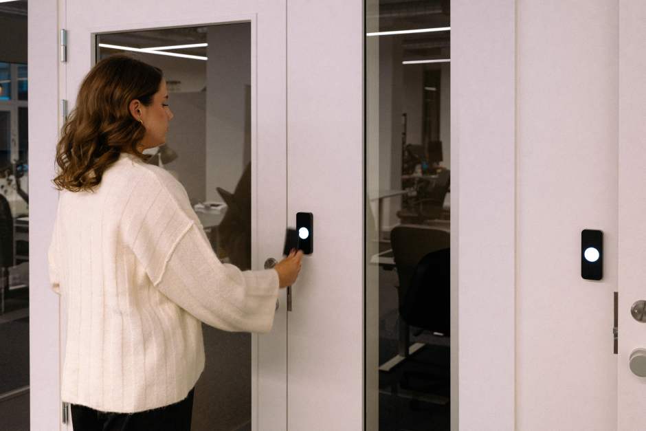Person unlocking a door supported by property technology