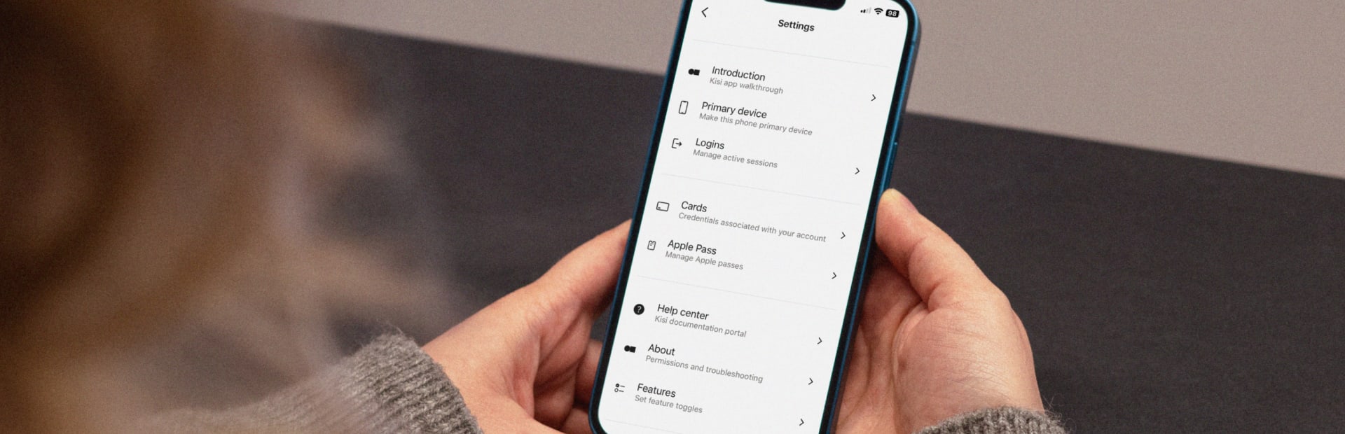 Person adding their Kisi employee badge to Apple Wallet with a click on their iphone
