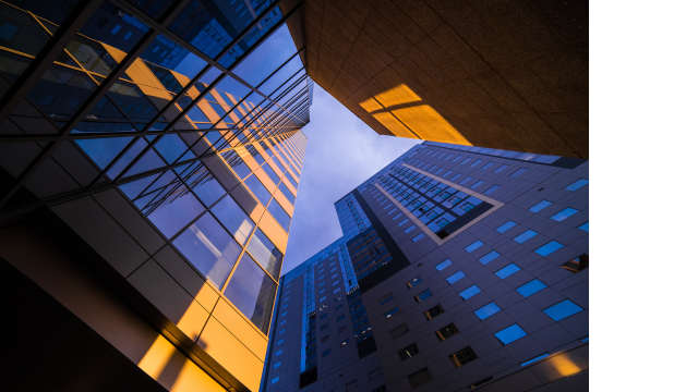 An image showing high commercial real estate buildings 