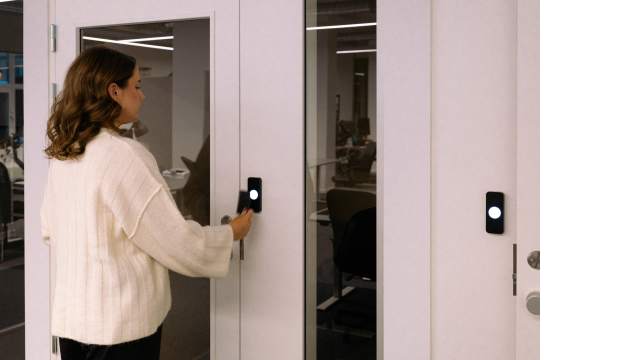 Person using the latest security tech to unlock a door