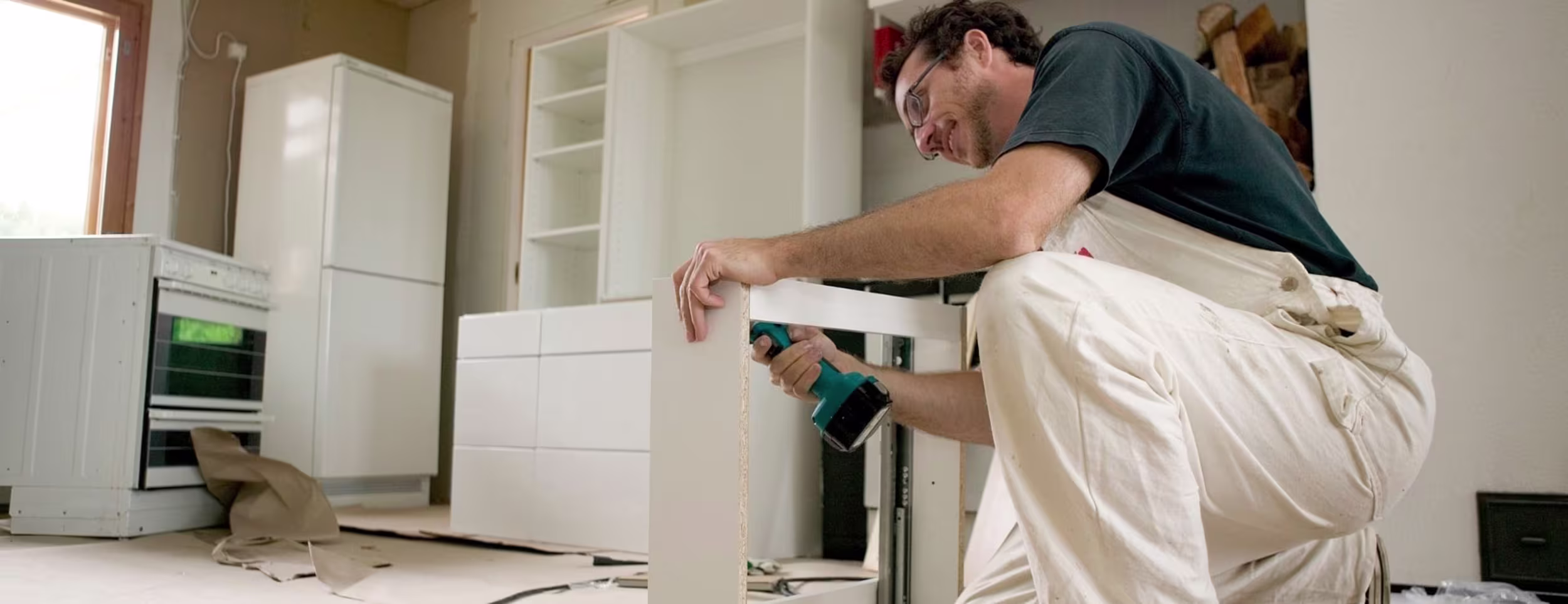 man fitting kitchen