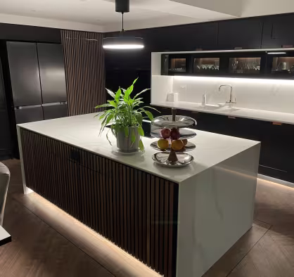 finished kitchen renovation in the dark with under cabinet lighting on