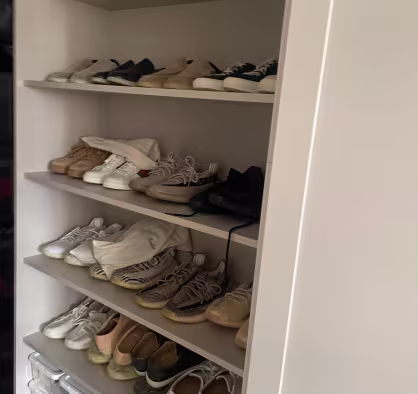 custom shoe storage built into a fitted wardrobe system