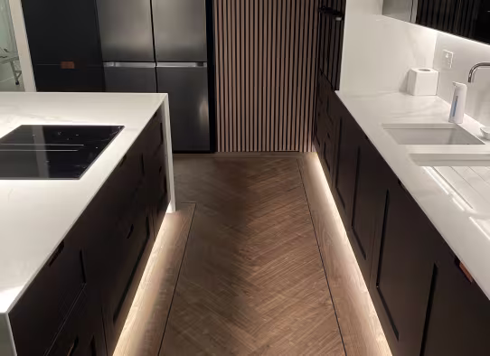 under cabinet lighting with herringbone floor