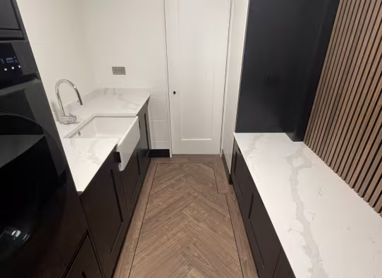 utility room matching kitchen style