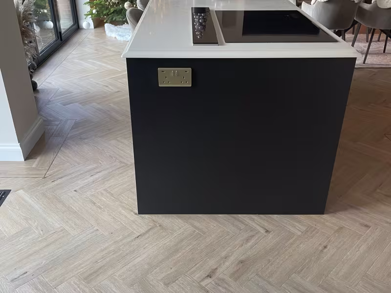 New kitchen island unit with dark grey doors and end panels