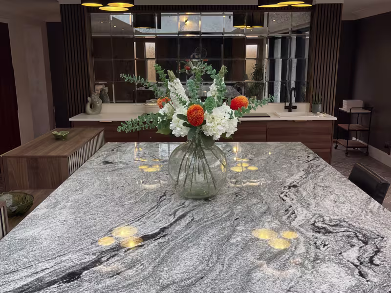 beautiful marble counter top with glass vase of flowers