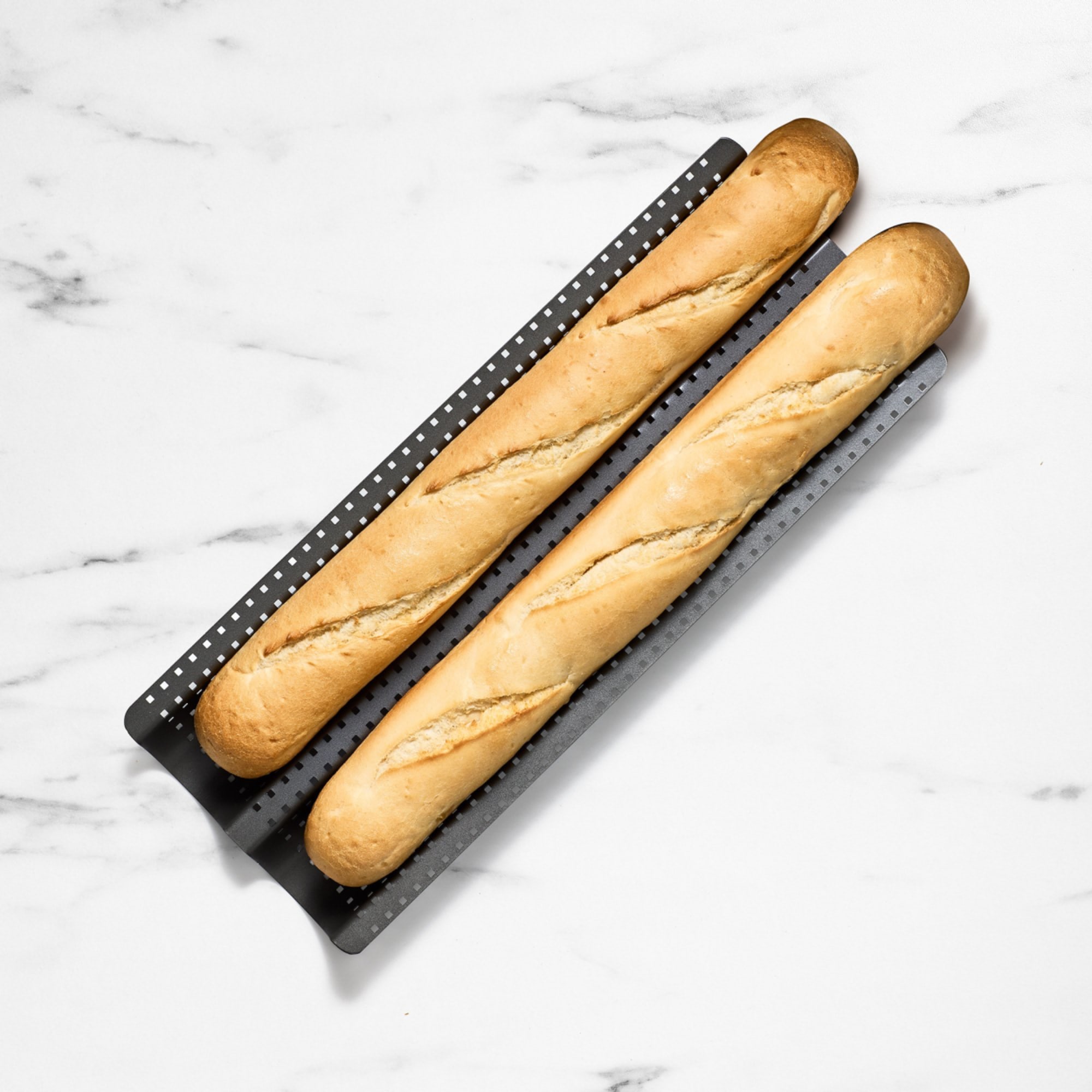 https://res.cloudinary.com/kitchenwarehouse/image/upload/c_fill,g_face,w_1250/f_auto/t_PDP_2000x2000/Kitchen%20Warehouse%20Images%20/Kitchen-Pro-Bakewell-Baguette-Tray-Crisper-37x24cm.jpg