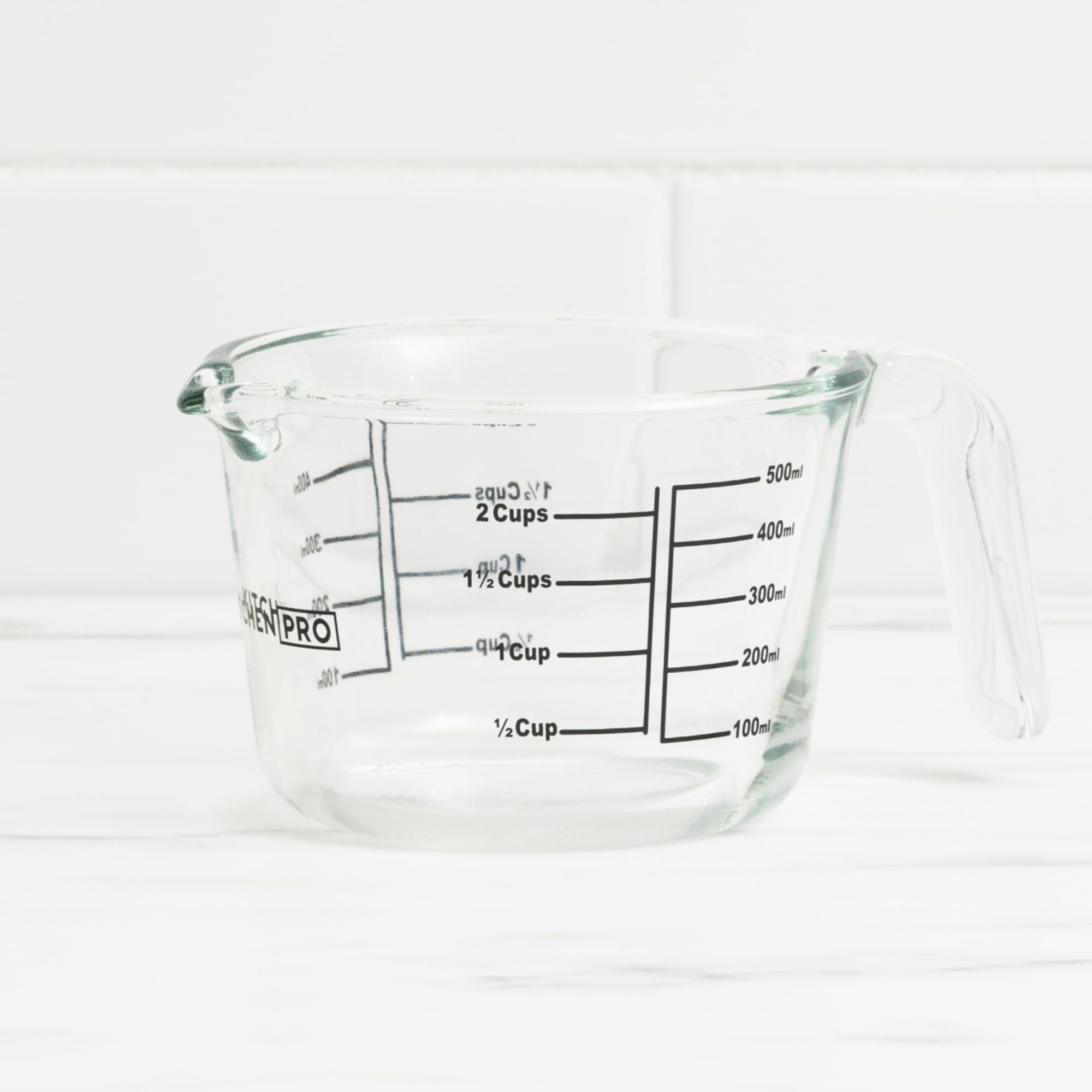 https://res.cloudinary.com/kitchenwarehouse/image/upload/c_fill,g_face,w_1250/f_auto/t_PDP_2000x2000/Kitchen%20Warehouse%20Images%20/Kitchen-Pro-Glass-Measuring-Jug-500ml-EMPTY.jpg?imagetype=pdp_full