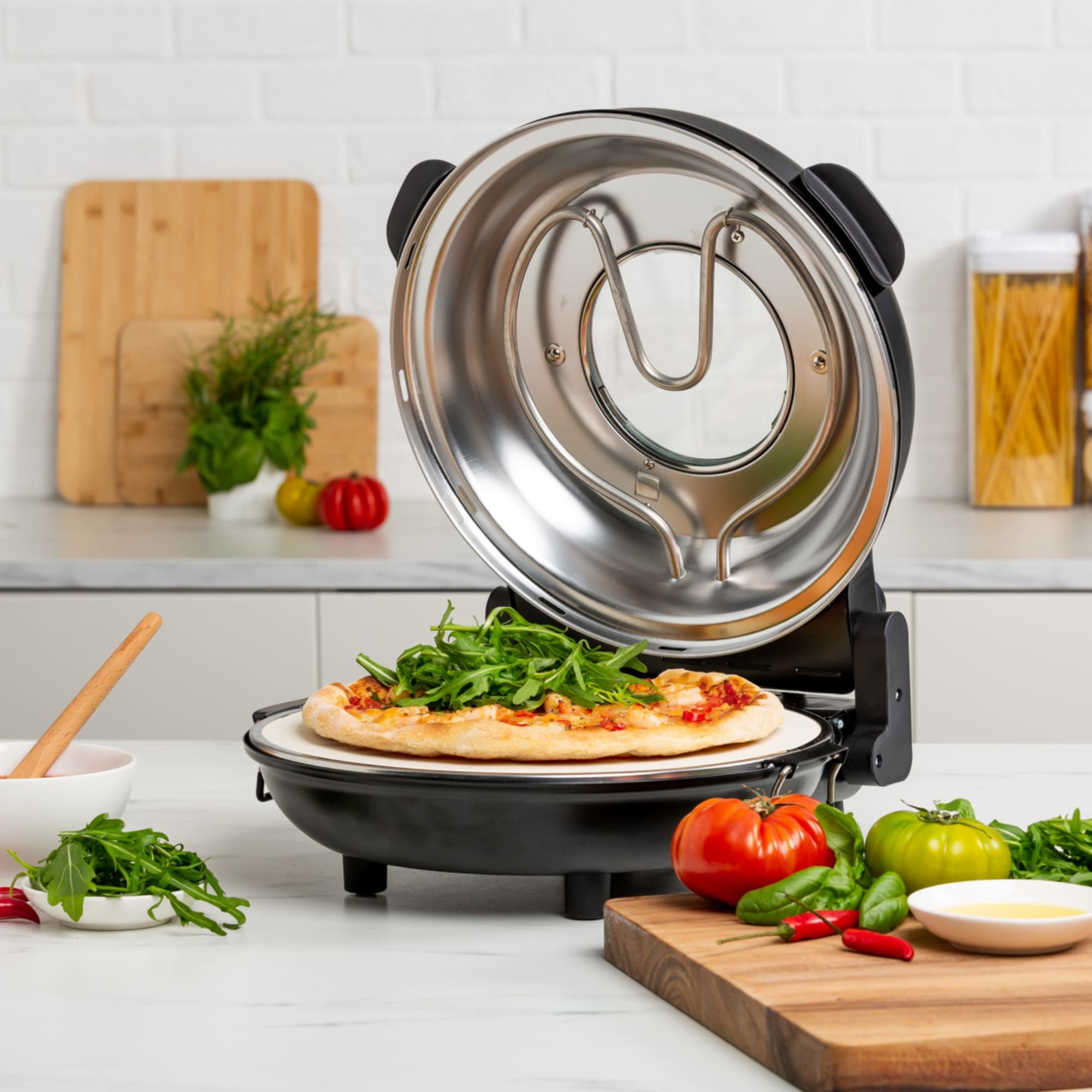 https://res.cloudinary.com/kitchenwarehouse/image/upload/c_fill,g_face,w_1250/f_auto/t_PDP_2000x2000/Kitchen%20Warehouse%20Images%20/Wolstead-Pro-Pizza-Oven-Matte-Black-Recipe-LS_03.jpg