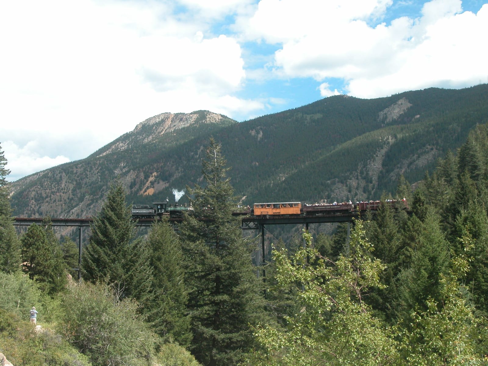 A Georgetown Loop train crossing the high steel bridge above Clear Creek