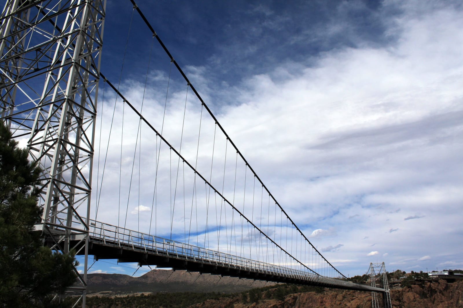 The Royal Gorge Bridge's suspension cables and deck stretching from its steel tower across the gorge