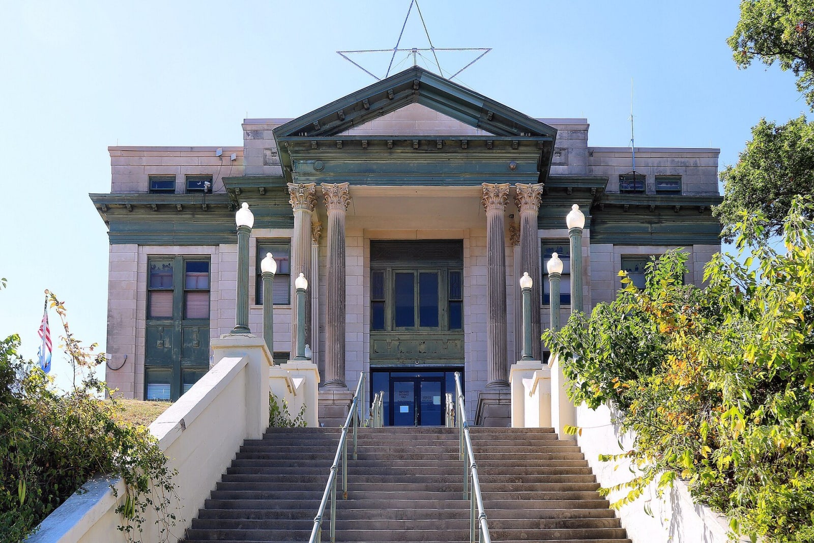 Steps climbing to the columned front of the 1914 Osage County Courthouse in Pawhuska.