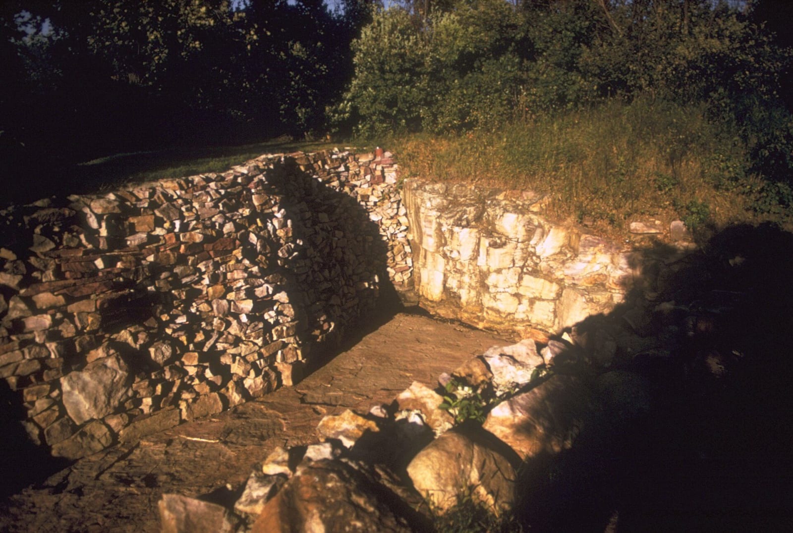 A quarry trench cut through layered rock at Pipestone National Monument in Minnesota, the source of the red pipestone