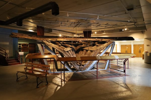 The recovered timber hull of the steamboat Arabia displayed in the museum gallery.