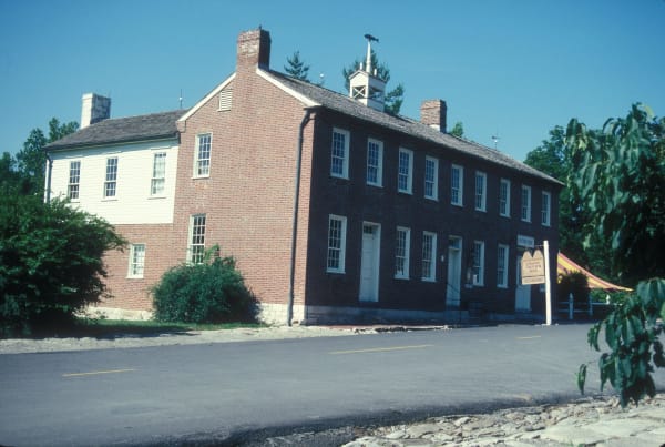 The two-story brick Arrow Rock Tavern with its rooftop bell on the main street of Arrow Rock.