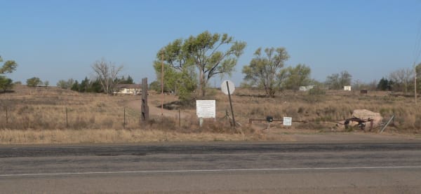 The fenced entrance to the Blackwater Draw archaeological site on the plains north of Portales