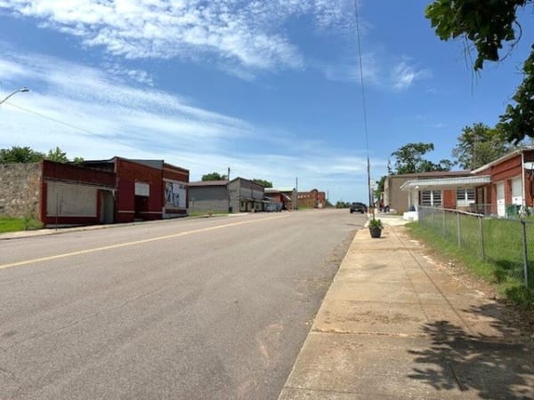 The main street of downtown Boley lined with brick commercial buildings.
