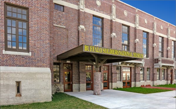 The red brick armory on Caroline Street in Houston that houses the Buffalo Soldiers National Museum, its name over the entrance canopy.