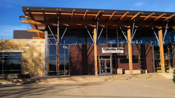 The timber-framed entrance of the exhibit building at the Chickasaw Cultural Center.