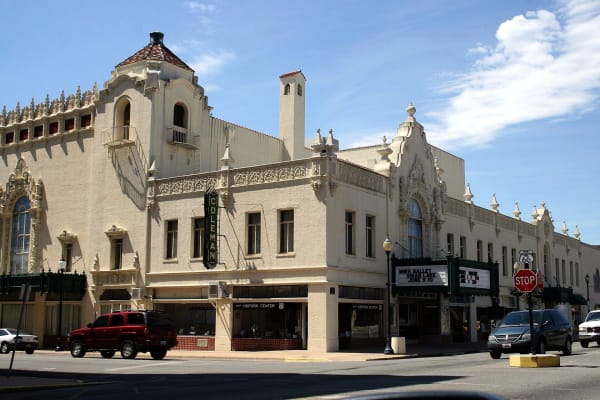 The cream Spanish Colonial front of the Coleman Theatre on Main Street in Miami, with its vertical COLEMAN sign and marquee.