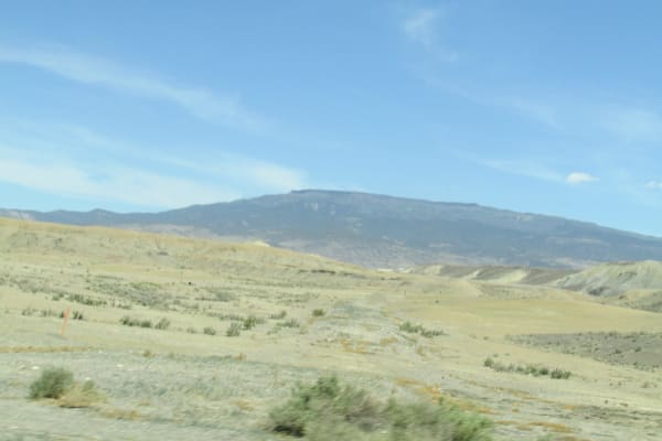 The long flat top of Grand Mesa above the dry valley floor