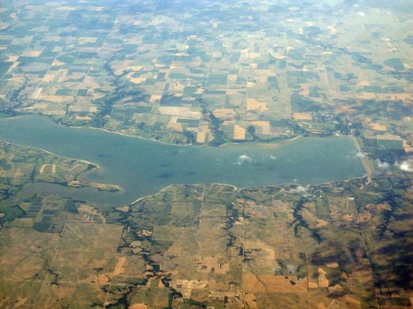 Harlan County Lake seen from an airplane, a long reservoir among farm fields and branching draws.
