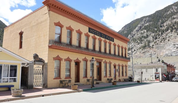 The Hotel de Paris in Georgetown, its painted masonry front beneath the valley wall
