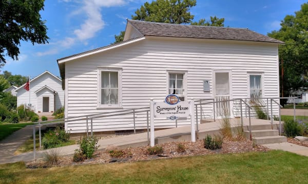 The white clapboard Surveyors' House in De Smet, where the Ingalls family spent the winter of 1879 to 1880, now kept by the Laura Ingalls Wilder Memorial Society in town