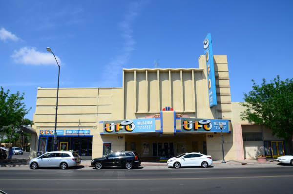 The International UFO Museum in a former movie theater on Main Street in Roswell, its marquee and vertical sign in blue and yellow