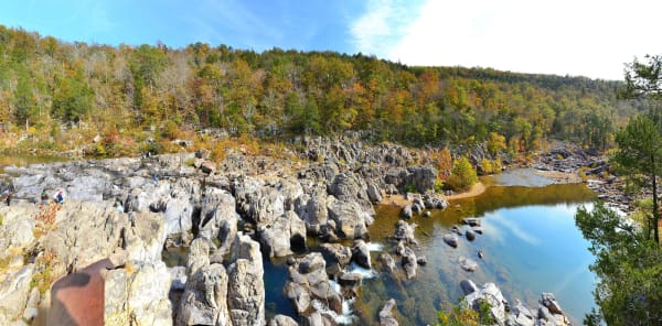 The East Fork of the Black River pouring through gray volcanic rock at Johnsons Shut-Ins in autumn.
