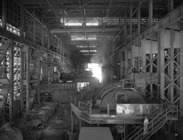 The interior of the Kaiser Steel mill at Fontana about 1949, steel framing and machinery under a high roof.