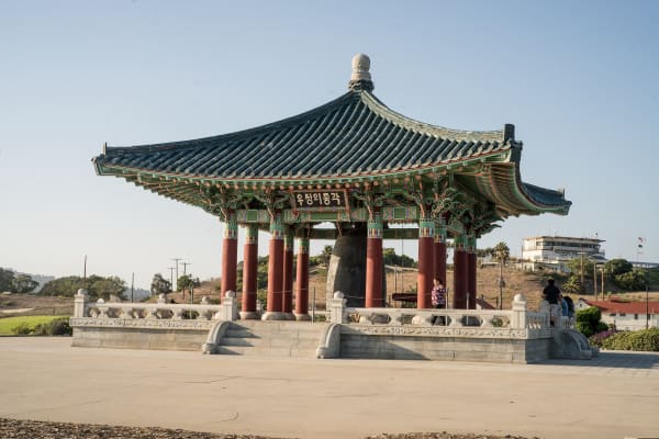 The Korean Friendship Bell hanging in its tiled stone pavilion on the bluff at Angels Gate, San Pedro.