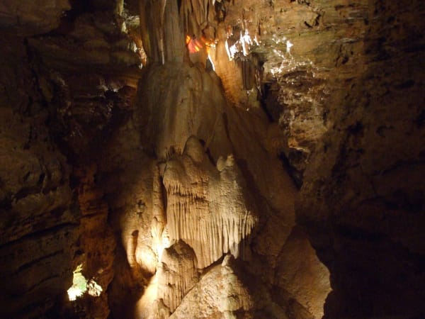 Lighted flowstone and stalactites of the formation called Blondies Throne inside Marvel Cave.