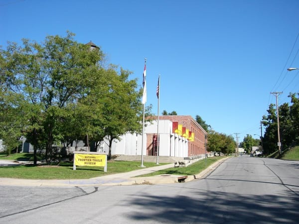The National Frontier Trails Museum and its yellow sign on West Pacific Avenue in Independence.