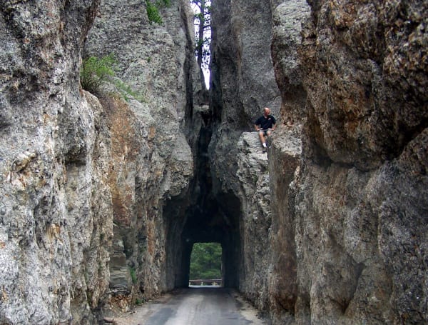 The narrow Needles Eye Tunnel cut through a wall of granite on SD-87