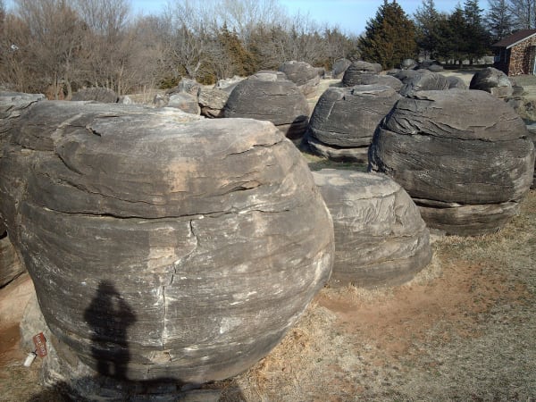 Large round sandstone concretions clustered on the ground at Rock City.