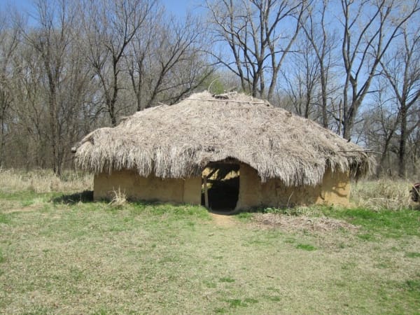 A reconstructed thatched house on the grounds of Spiro Mounds Archaeological Center.