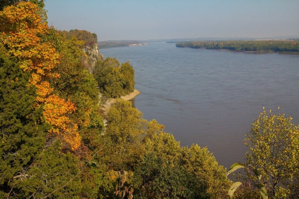 The broad Mississippi River below autumn-colored bluffs at Trail of Tears State Park.