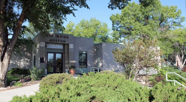 The Ute Indian Museum building in Montrose among trees and plantings