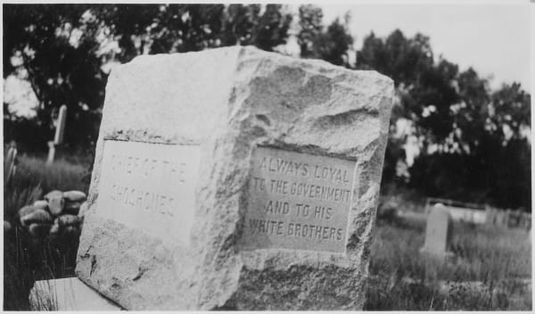 An archival photograph of the granite monument over Washakie's grave at Fort Washakie, its faces carved Chief of the Shoshones and Always loyal to the government and to his white brothers