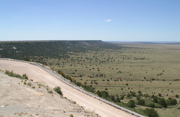 The escarpment at the northwestern edge of the Llano Estacado, a road curving down it toward the plains of eastern New Mexico