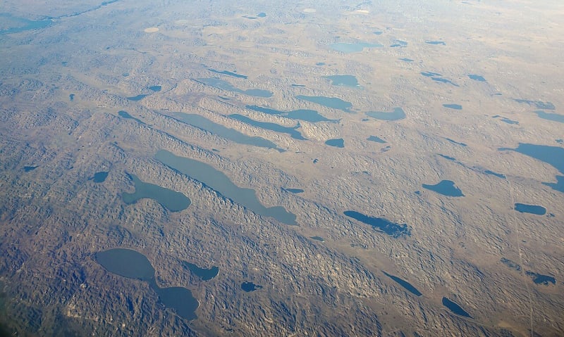 Seen from the air, long lakes lie in the hollows between rows of grass-covered dunes at Valentine National Wildlife Refuge.