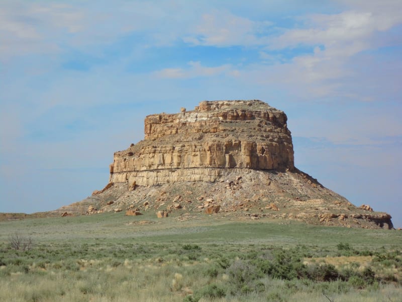 Fajada Butte rising alone above the grassland at the mouth of Chaco Canyon