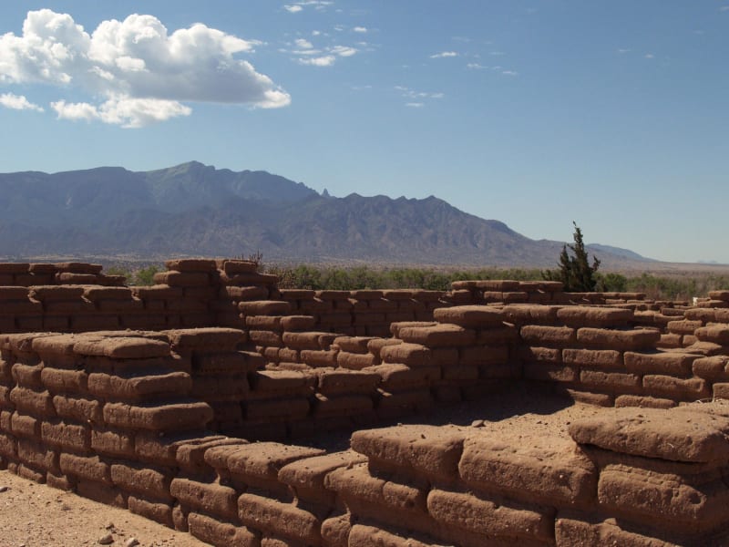 Adobe walls of Kuaua, the northernmost of the Tiwa towns, with the Sandia Mountains beyond